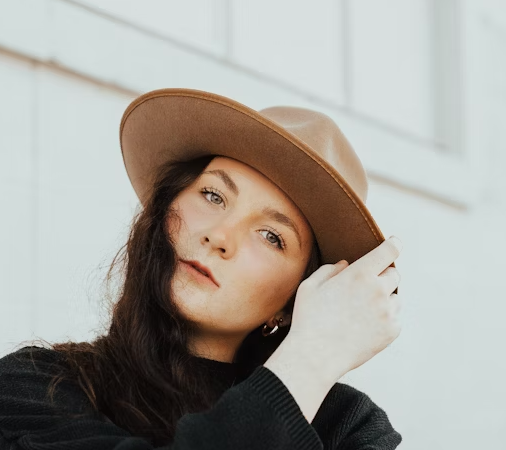 Woman wearing brown hat